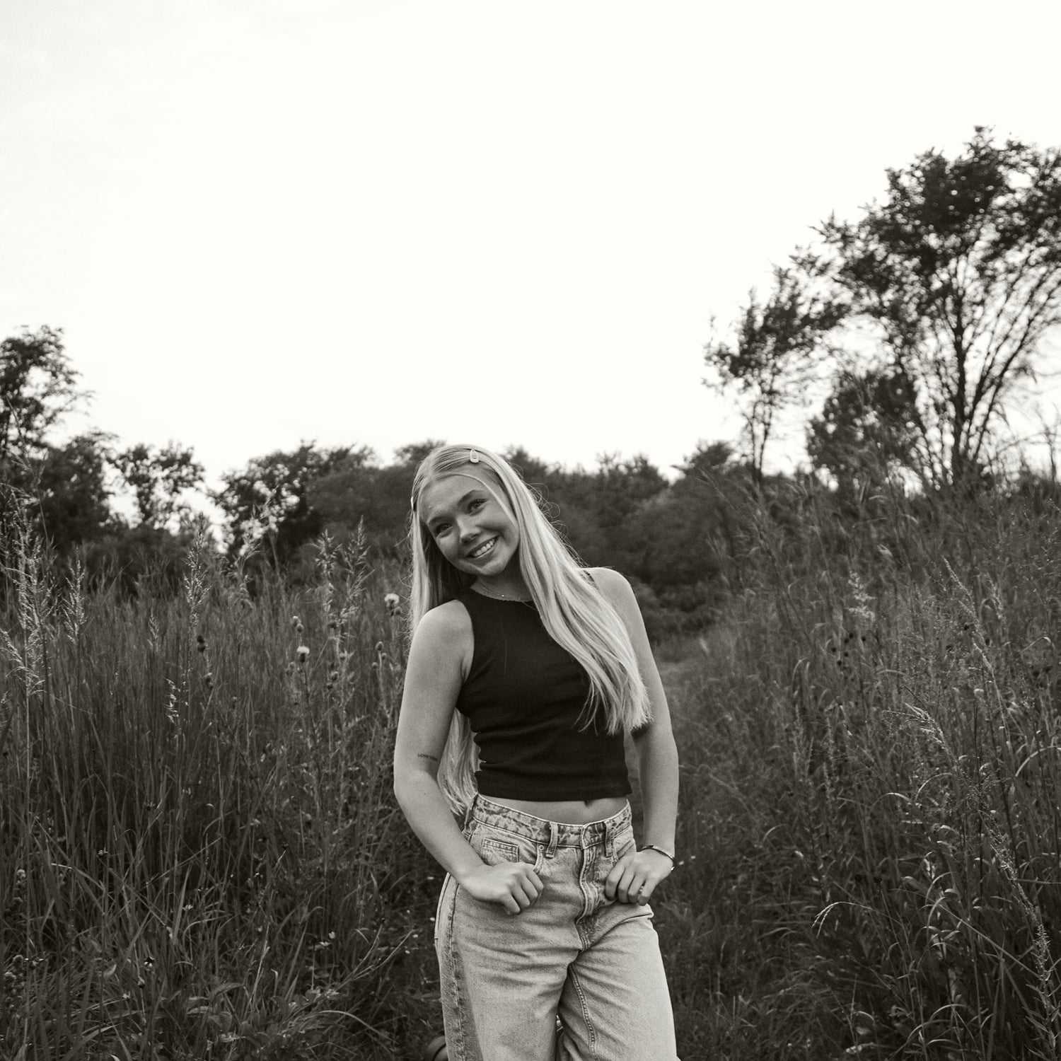 Portrait of Olivia, a professional stylist at 4 North Beauty Collective, showcasing their expertise and style.