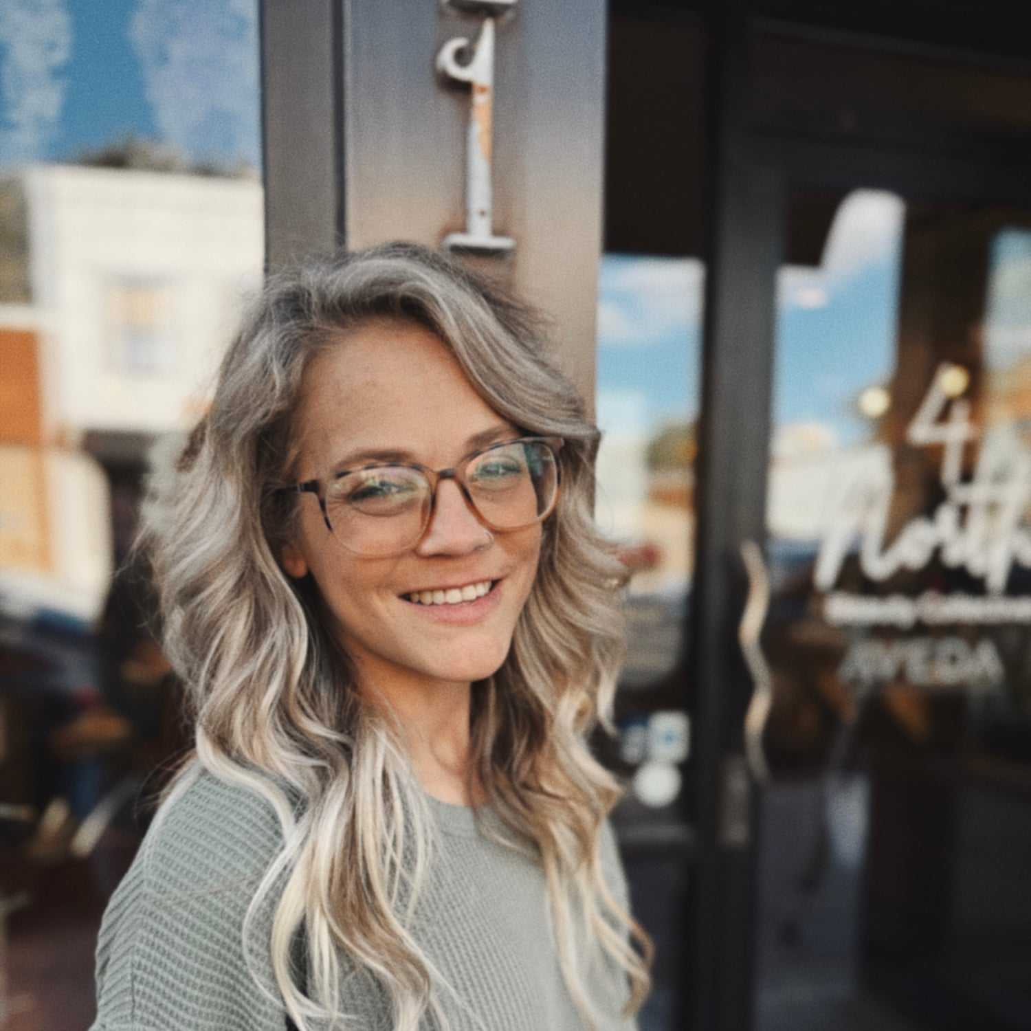 Portrait of Emily, a professional stylist at 4 North Beauty Collective, showcasing their expertise and style.
